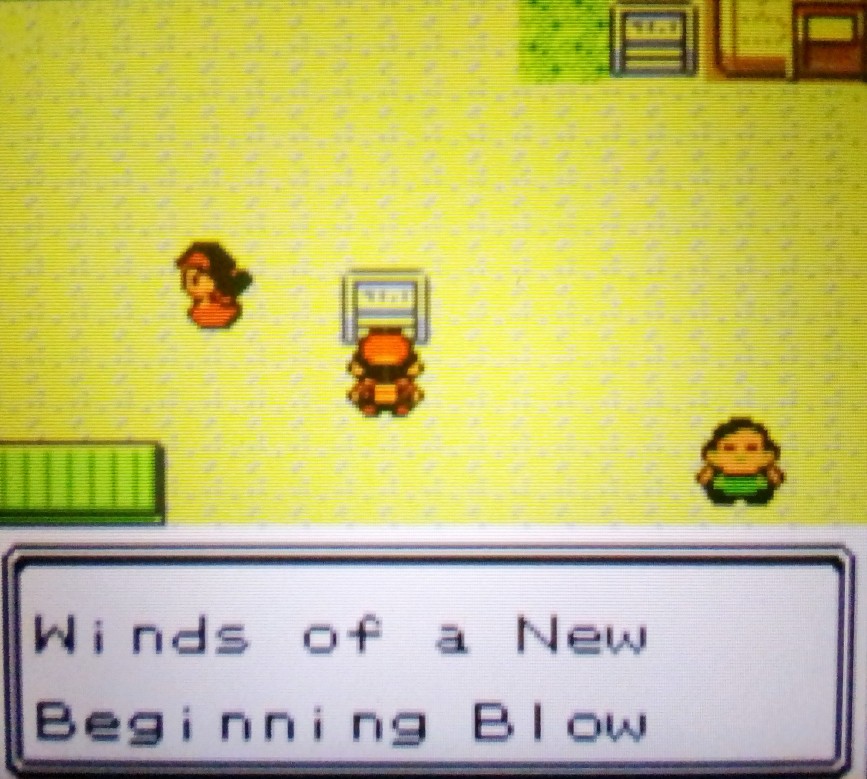 Player reading the town slogan for "New Bark Town" in Pokémon Crystal:  "Winds of a New Beginning Blow"