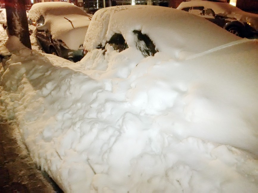 Two cars buried in the snow in Brooklyn Heights, seen on February 2, 2021.