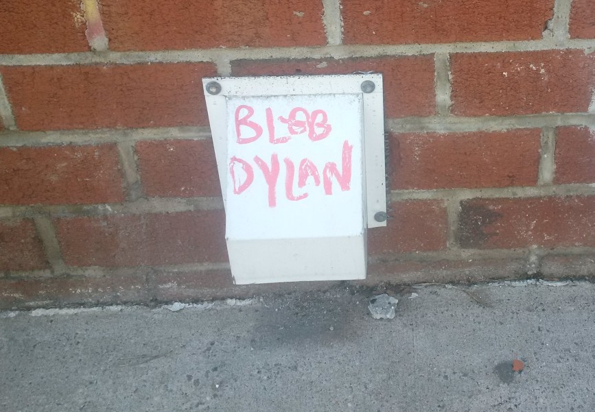 Picture taken by N.A. Ferrell of "Blob Dylan" written with marker in Bushwick, Brooklyn.