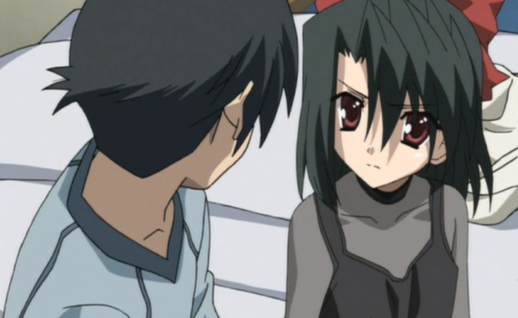 Makoto stares in Setsuna's eyes while they sit on his bed in the School Days anime series.