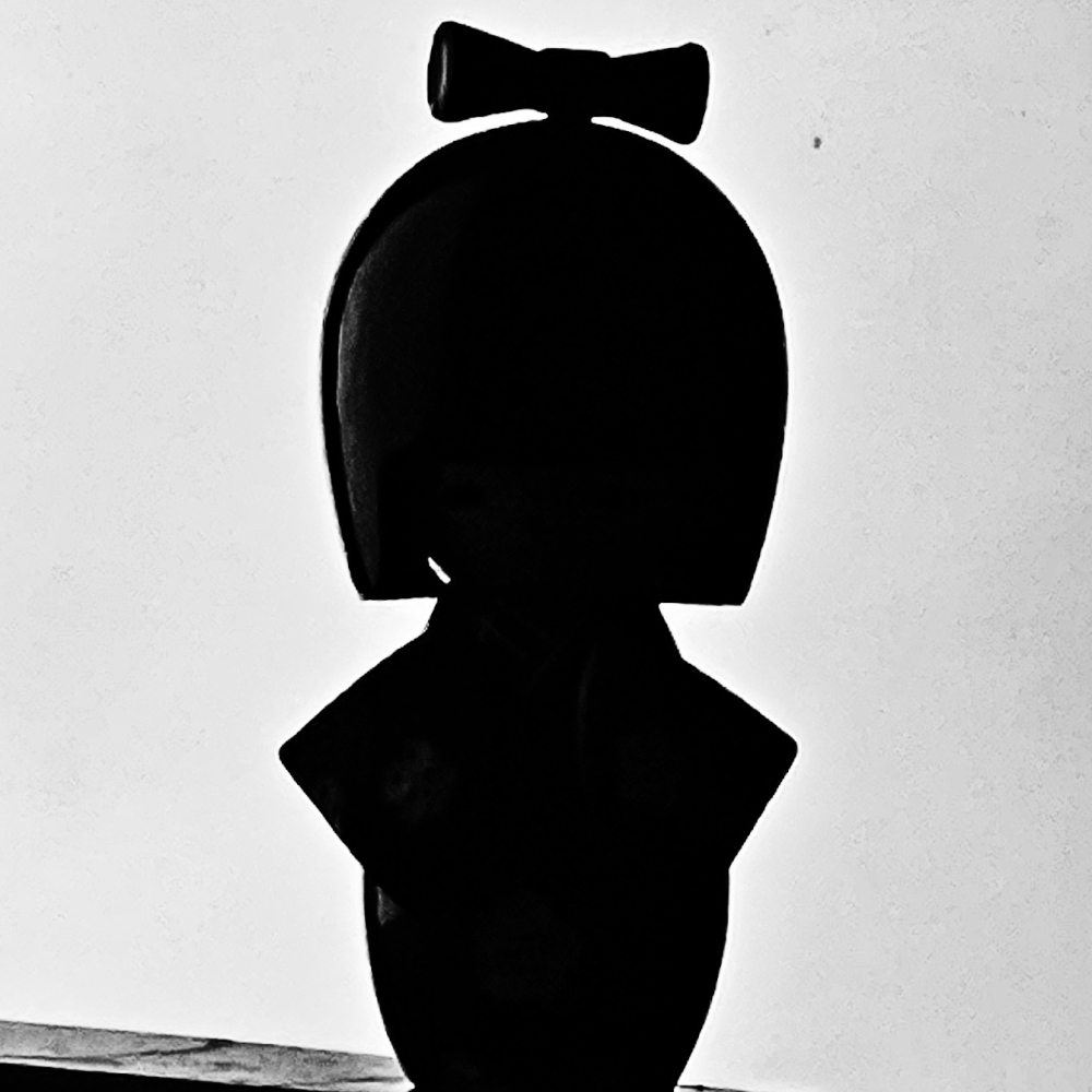 Retouched photograph of a kokeshi doll silhouette by Victor V. Gurbo.