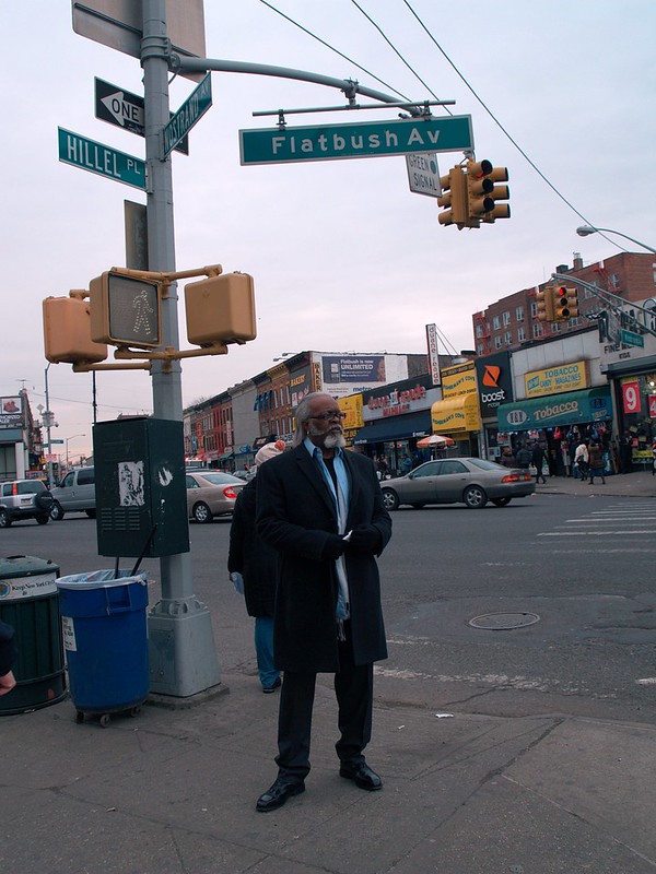 Jimmy McMillan standing at the intersection of Flatbush Avenue and Hillel Streets in 2011.
