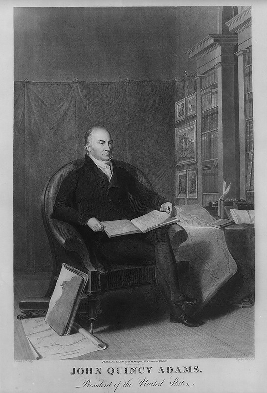 Painting of John Quincy Adams sitting cross-legged with a book.