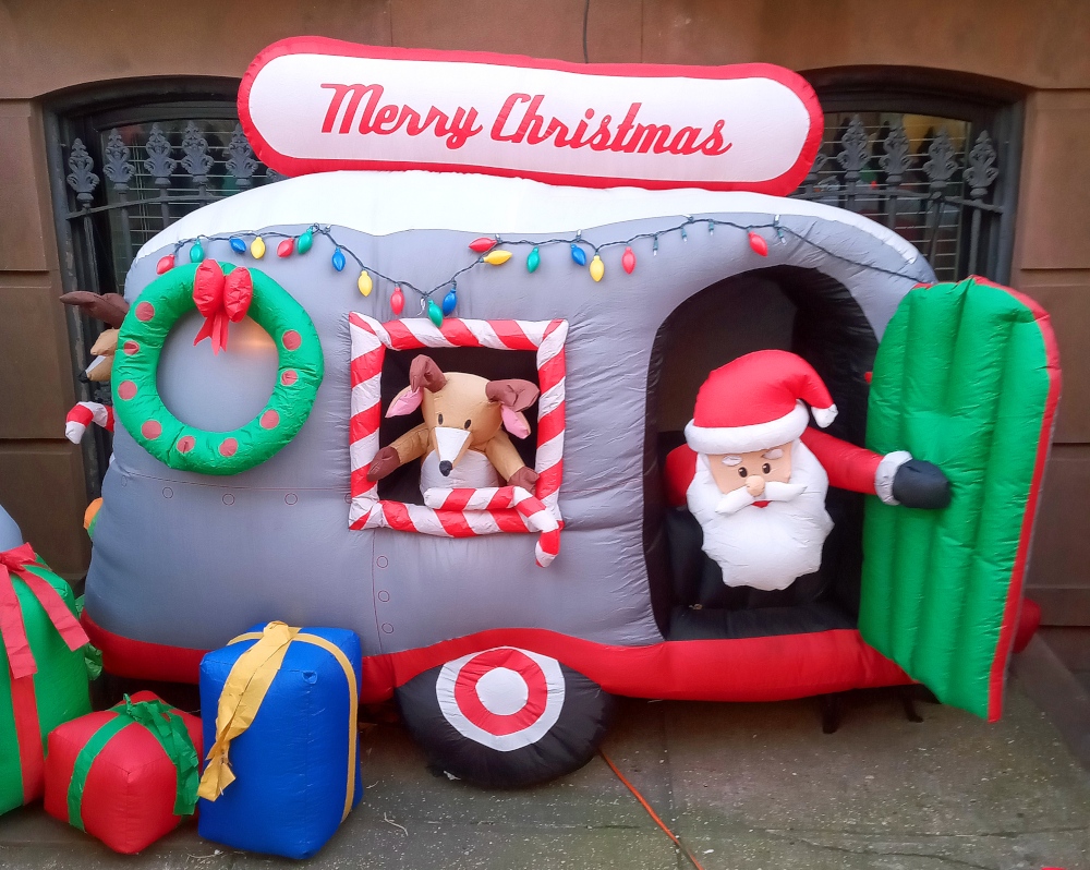 An inflatable Santa Claus Christmas van seen in Clinton Hill, Brooklyn.