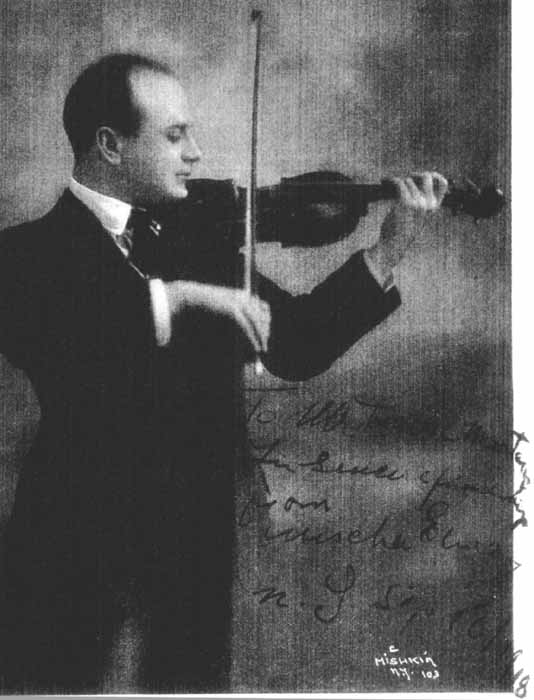 Signed photograph of Mischa Elman playing the violin.