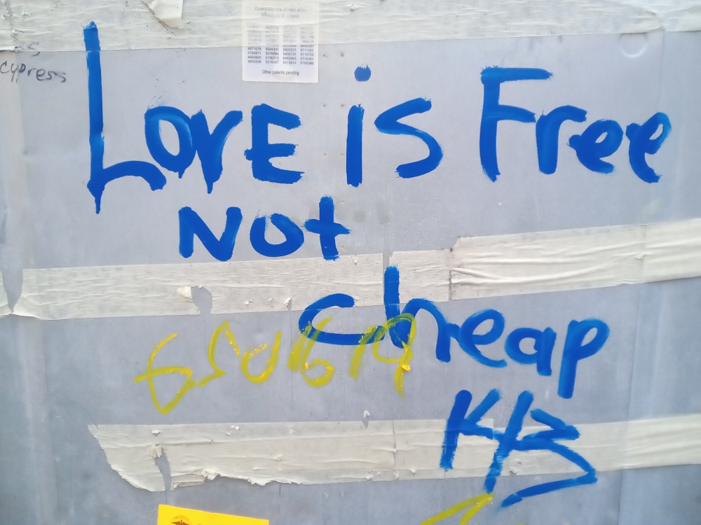 "Love is Free Not cheap" graffiti seen on the back of a discarded refrigerator in Clinton Hill, Brooklyn.