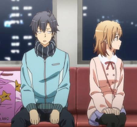 Screen capture of Hachiman Hikigaya and Iroha Isshiki of Oregairu having a conversation together on a train in episode 10 of the second season.
