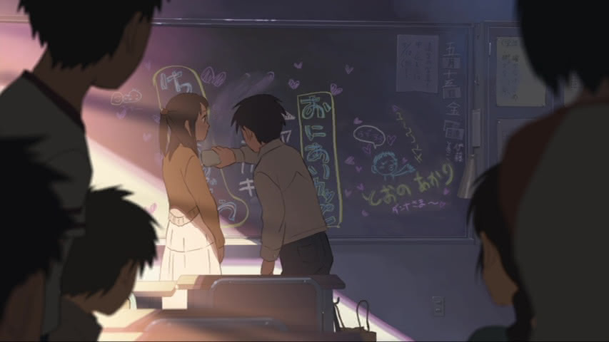 Takaki erases jokes about him and Akari from his classroom's blackboard with Akari looking on in the first act of 5 Centimeters Per Second.