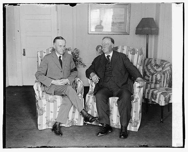1923 black and white photograph of then-President Calvin Coolidge on the left sitting next to former President and Supreme Court Chief Justice WIlliam Howard Taft.