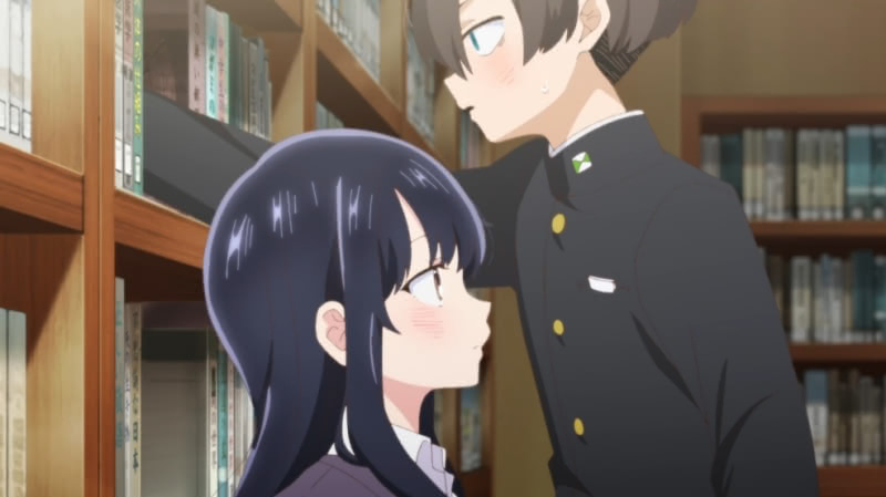 Kyoutarou marking Anna's heaight while standing over her in the school library.