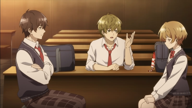 Tomozaki and Tama sit facing each other in a lecture room while Mizusawa speaks to Tala from behind a desk. Tama's head is slightly bowed.