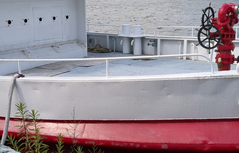 A boat at Brooklyn Bridge Park with painted over text: Governor Alfred E. Smith.