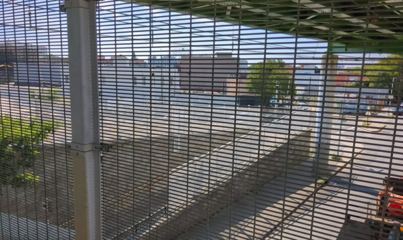 Looking through fence on Hamilton Avenue Footbridge into Red Hook.