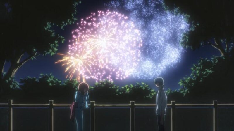 A crying Karada in a yutaka facing a stoic Hiro in night with fireworks in the background.