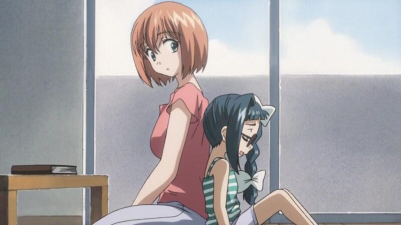 Karada and Shouko sit on teh floor back to back while Shouko talks with a smile and Karada listens.