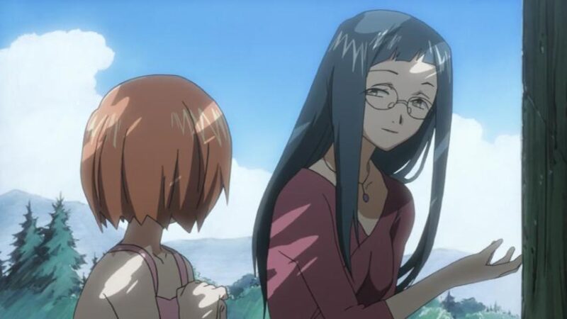 Child Karada looks at Shouko who asks her about the wishing stones by the road side.