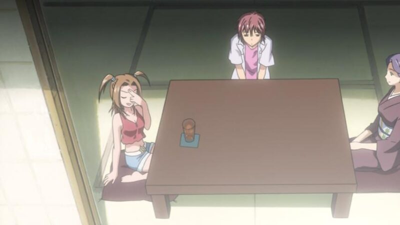 Kotomi, Tetsu, and Tetsu's mother sit on three sides of a Japanese low table on tatami mats.